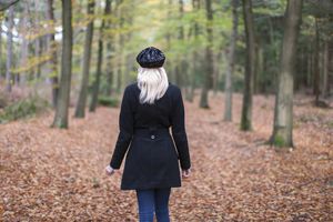 Woman walking alone in the forest