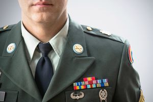 Close up of Caucasian soldier wearing decorated military uniform