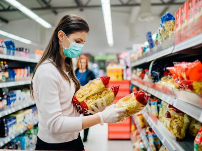 Woman shopping and wearing a mask.