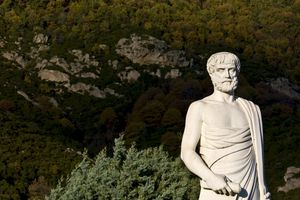 Aristotle statue with foliage located in Stageira, Greece