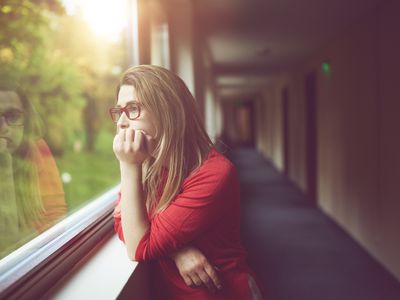 Woman staring out window